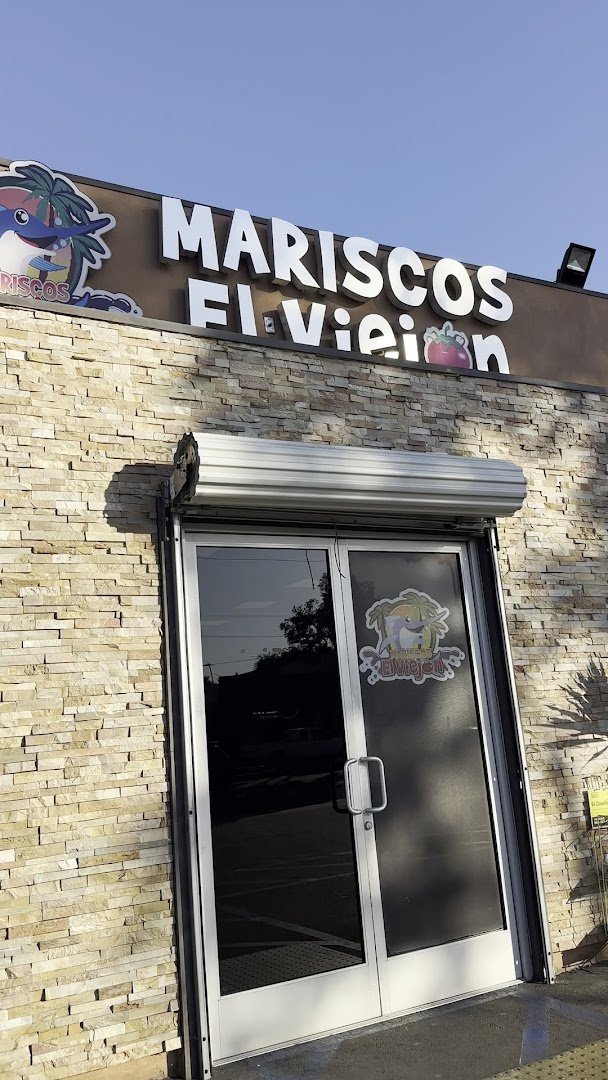 Outdoor seating beside a lively Mexican seafood spot.