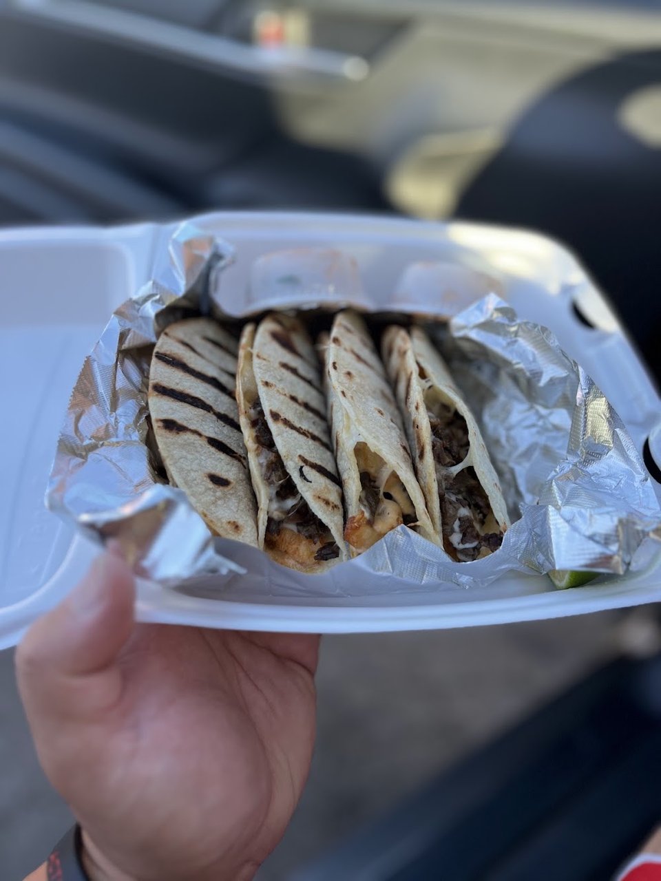 Printed menu with seafood dishes and tacos.