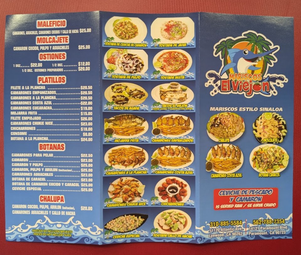 Menu board showing tostadas, tacos, and quesadillas.